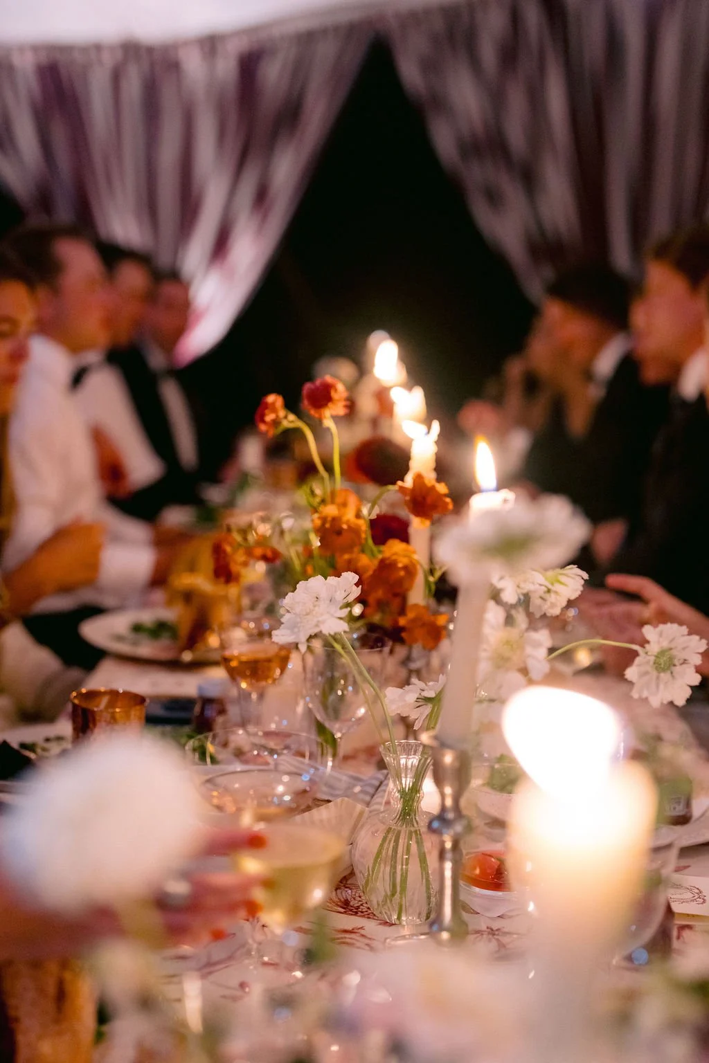 laurie-arons-special-events-montana-family-estate-wedding-candlelit-reception-table-seasonal-wildflowers-striped-tent-layers-of-pattern.jpg