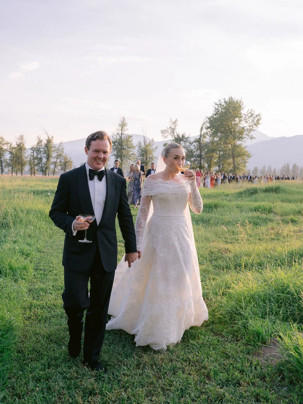 laurie-arons-special-events-montana-ranch-wedding-newlyweds-stroll-meadow-sunset-celebration-montana.jpg