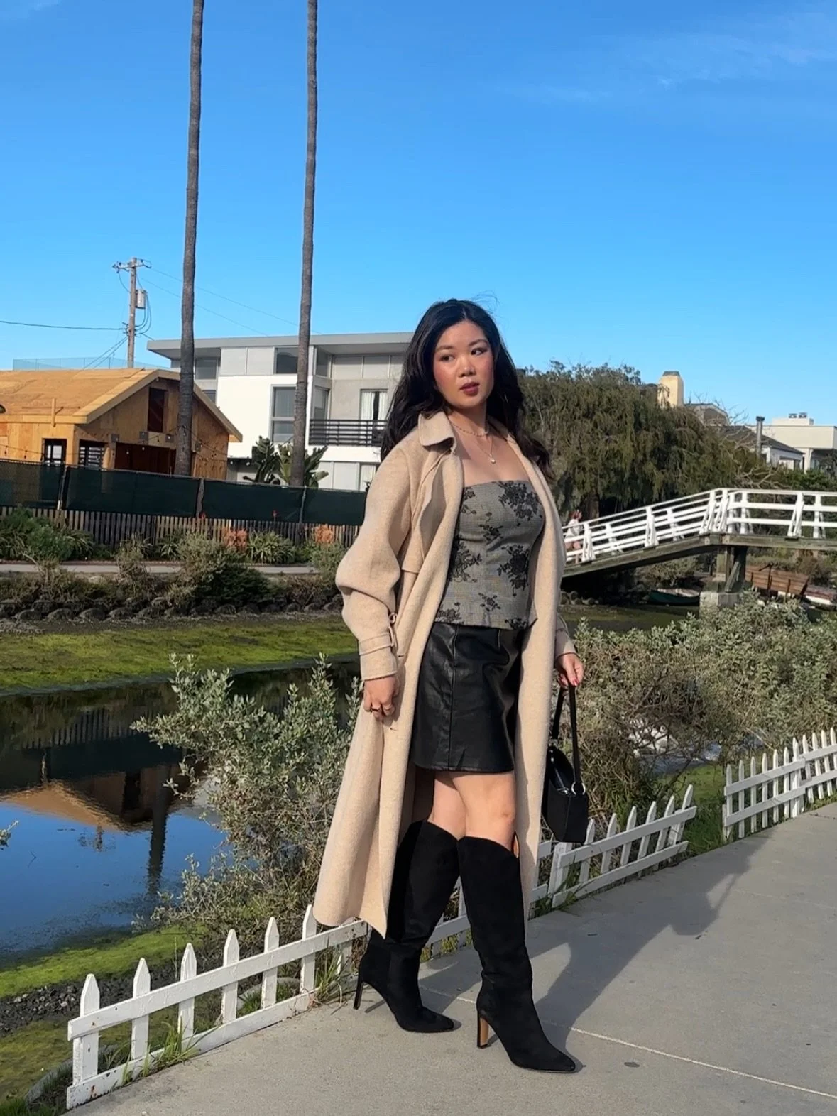 A storm is brewing 🌨️
.
Outfit details:
@lucyparislabel coat + top 
@aeropostale skirt 
@vici boots 
@lulus purse 
.
.
.
#winteroutfitideas #winteroutfits❄️ #chicoutfits #xoxo_tiana_xoxo  #winterootd❄️