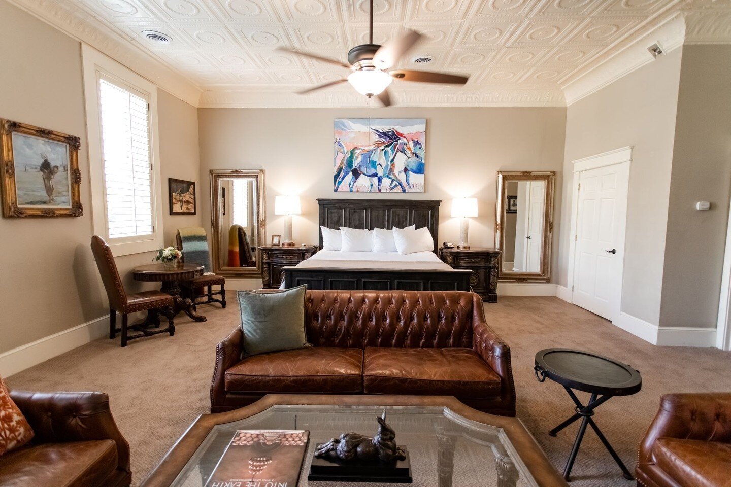 Welcome to the Owner's Suite. 
Our goal in this room is to make you feel at home, and feel the history of our building. 
Hand picked artwork, books of all ranges in our hand made bookcases, and a soaking tub in the bathroom. 
Who would want to leave?