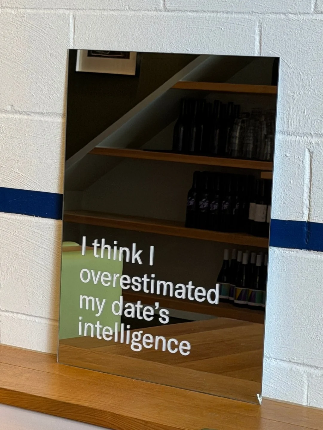 I Think I Overestimated My Date's Intelligence, Laura Brinin, 2026, vinyl secrets from spoken conversation on mirror, 48 x 60 cm, $280, Not Framed