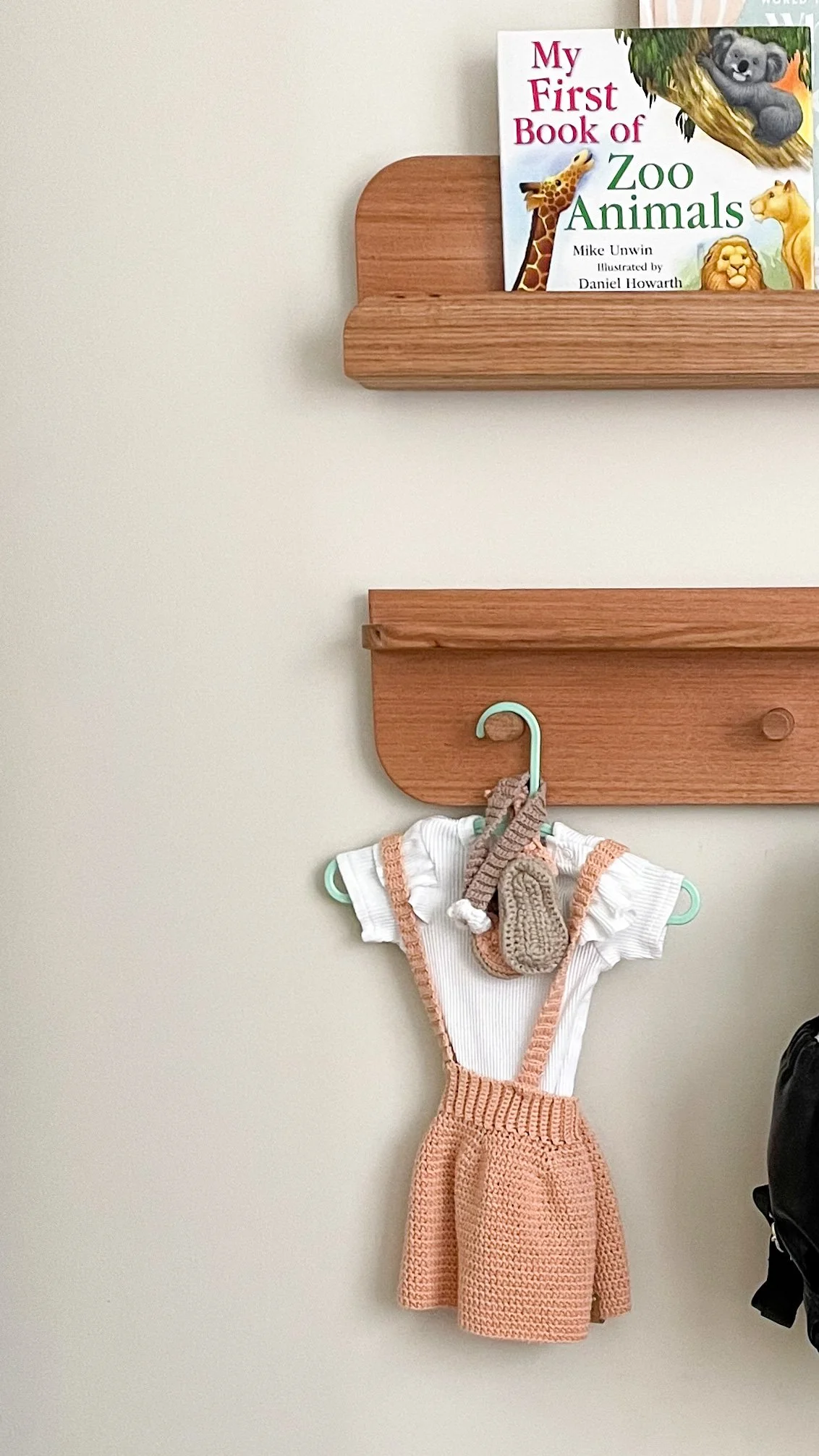 Hardwood Shelving System with hanging crochet baby girls outfit