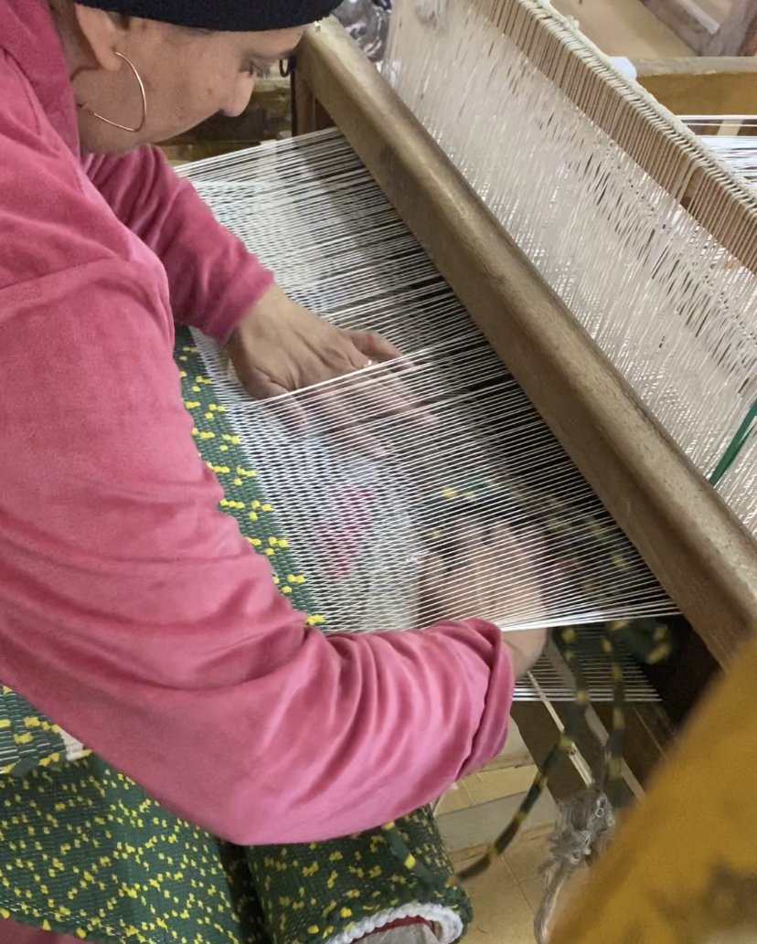 lady on manual loom.jpg