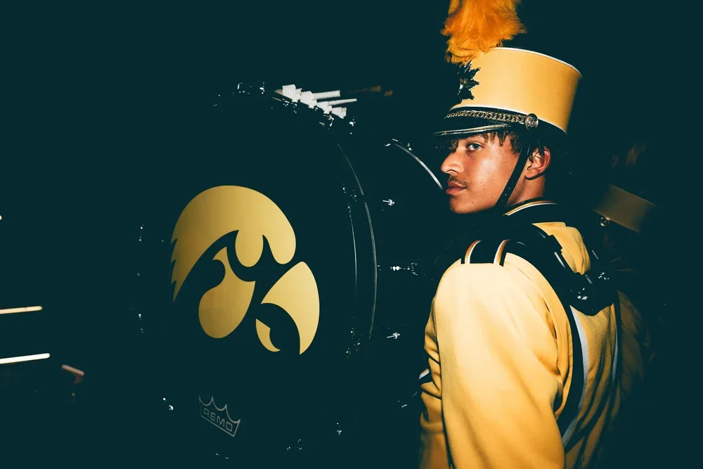 IOWA CITY EVENT PHOTOGRAPHER - PICTURE OF HAWKEYE MARCHING BAND BASS DRUMMING WALKING OUT OF THE TUNNEL ON TO DUKE SLATER FIELD