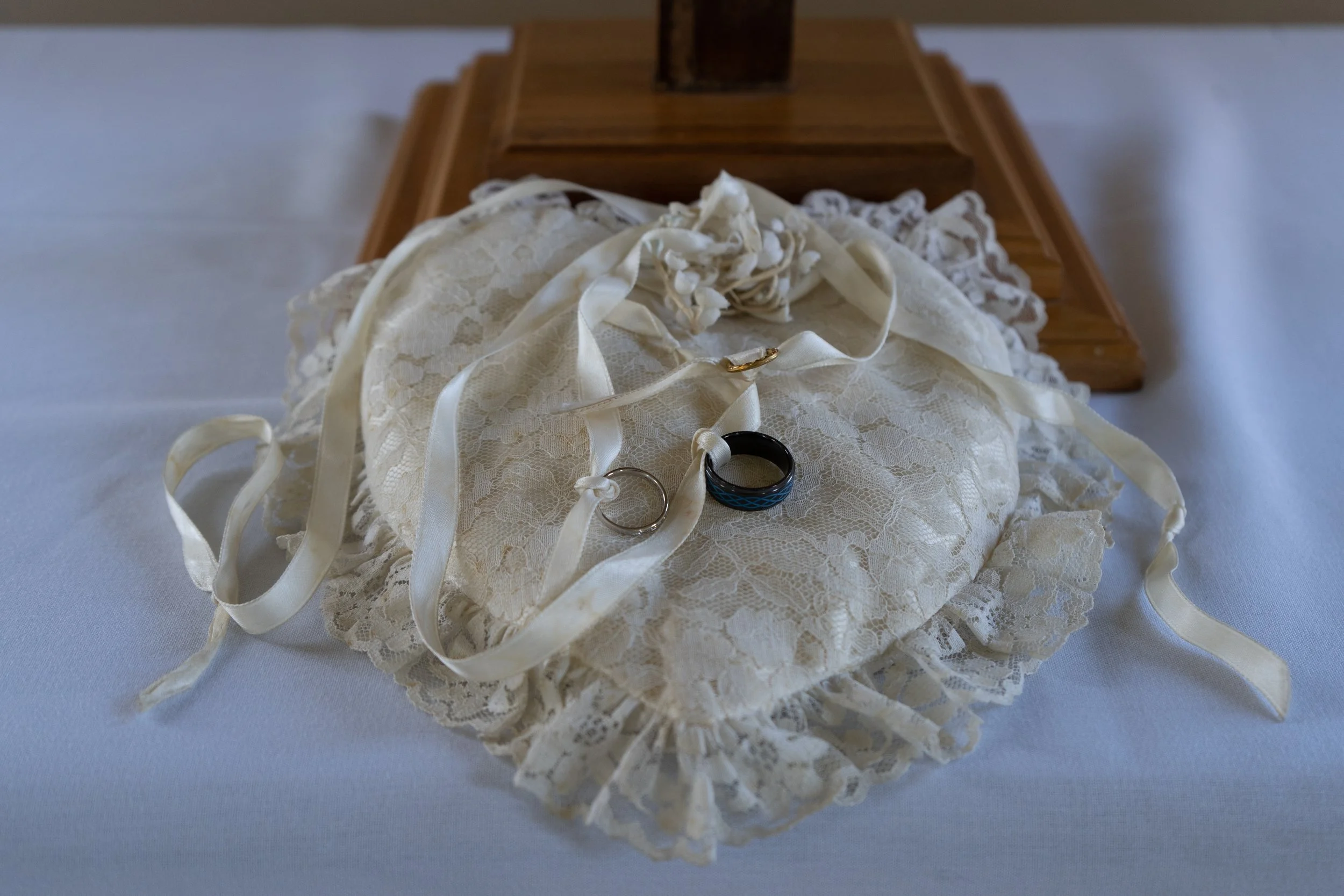 BEFORE THE WEDDING STARTS, TWO RINGS WERE LAYED OUT ON A HEART SHAPED PILLOW