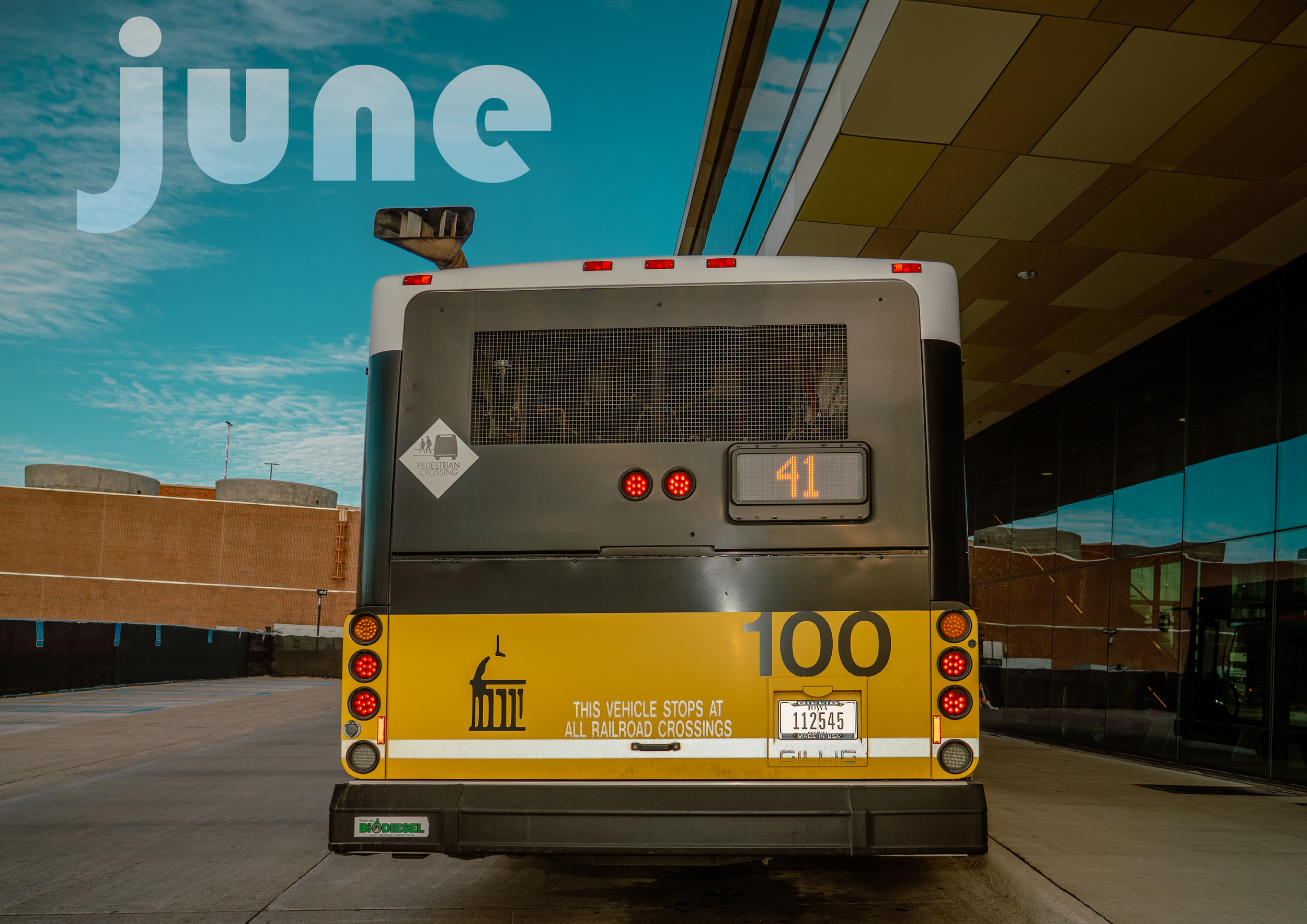 A CALENDAR PAGE OF A YELLOW CITY BUS THAT SAYS "JUNE"