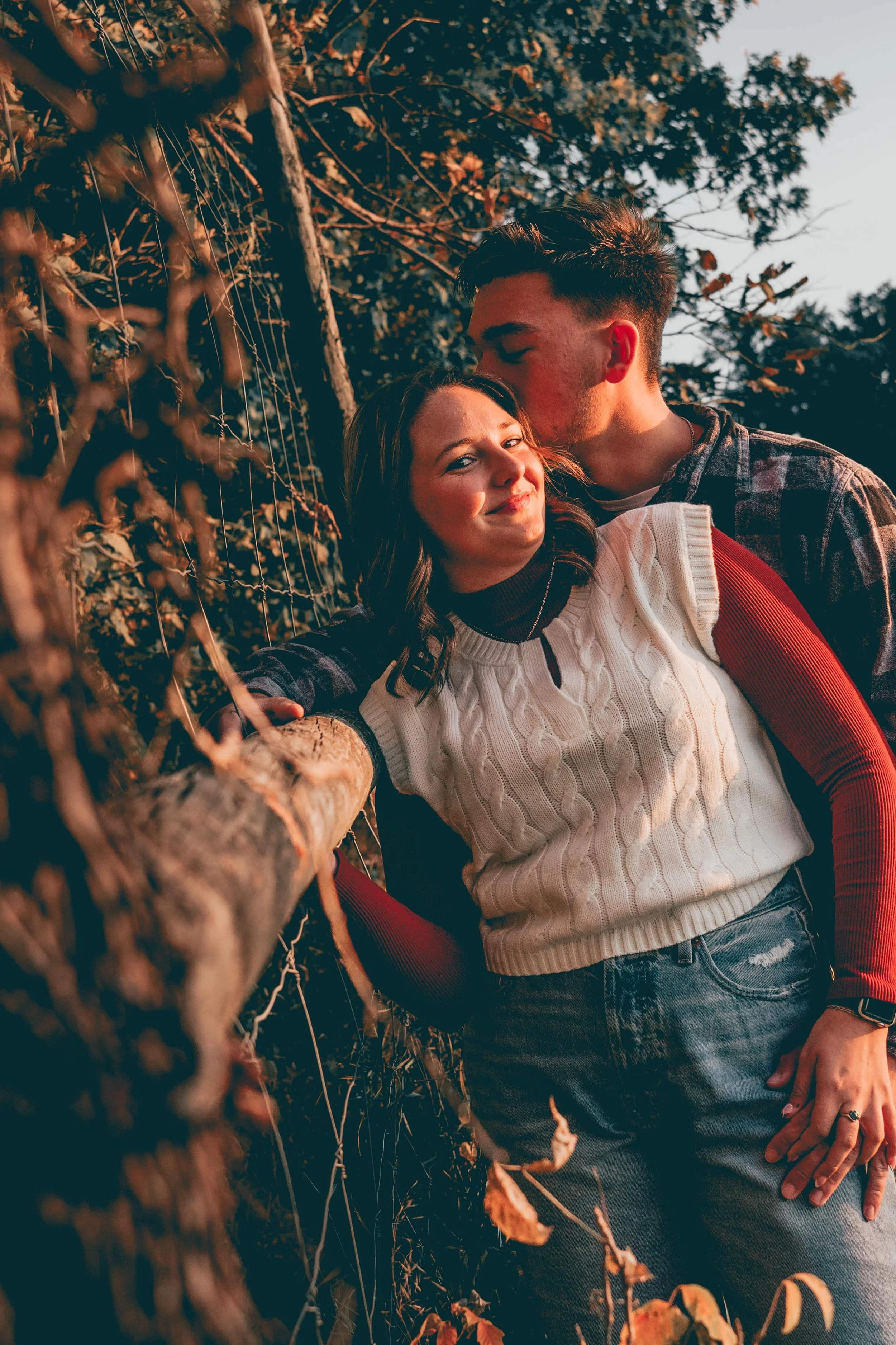IOWA CITY COUPLES PORTRAIT SESSION - A PICTURE OF CUTE COUPLE ON A TRACKING, COUPLE PHOTOS IN IOWA'S WILLSON'S ORCHARD DURING GOLDEN HOUR AT NIGHT