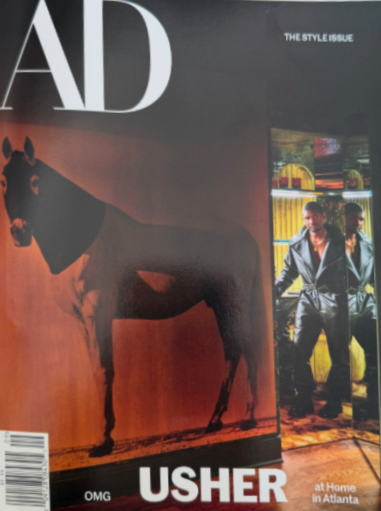 Cover of Harper's Bazaar style issue featuring an abstract image of a giraffe and a photograph of two men in leather jackets standing by a colorful storefront window, with the title 'AD' at the top.