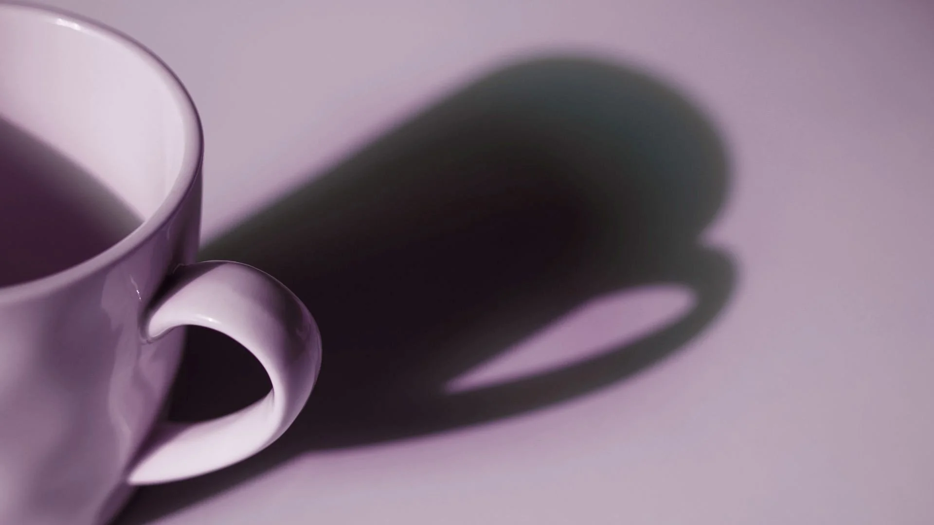 Coffee cup casting a long shadow, symbolizing the future potential of today’s financial choices.