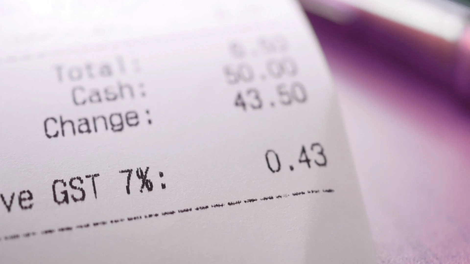 Close-up photo of a receipt representing the emotional noise and mental weight that money can sometimes create in everyday life.