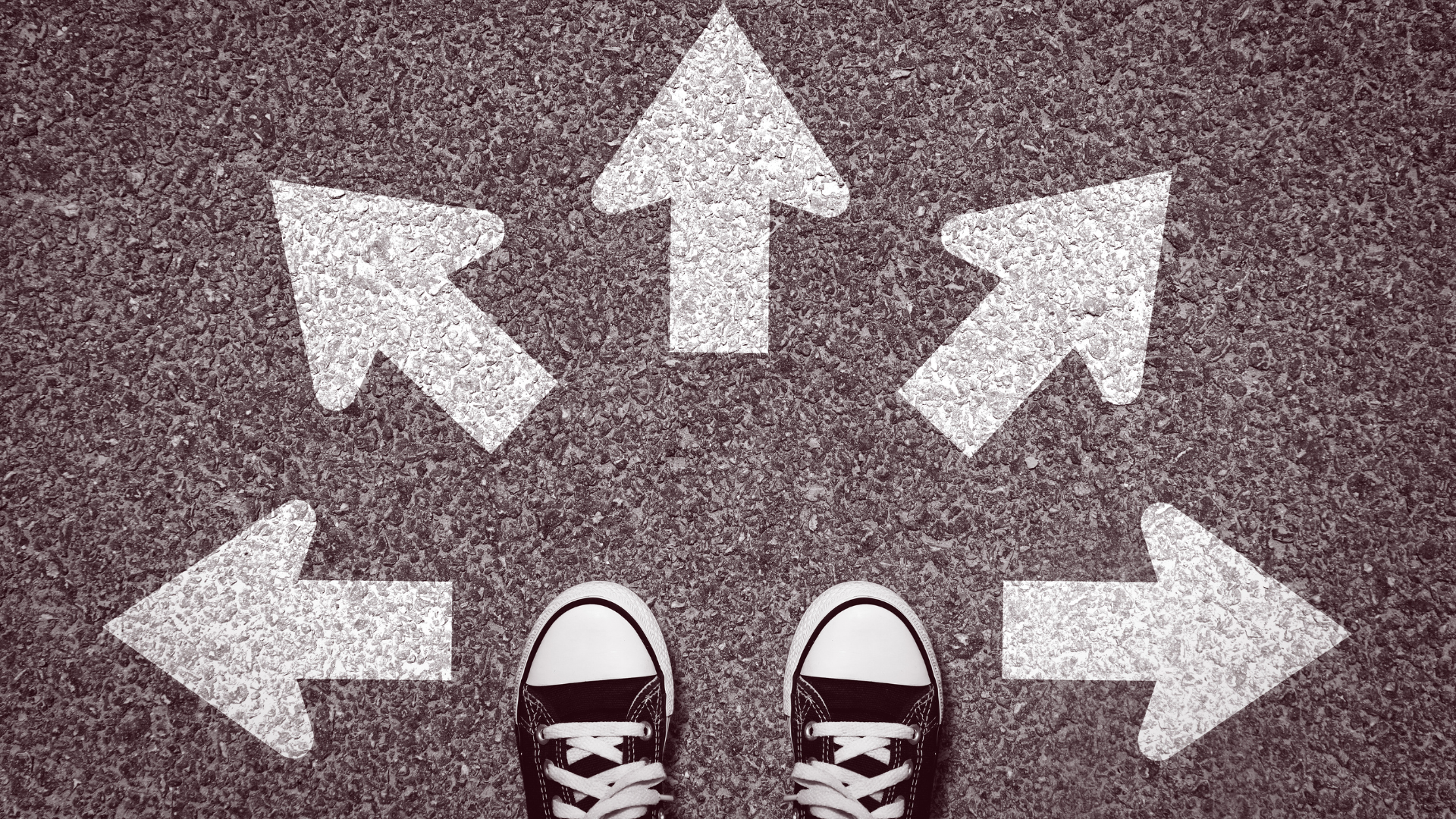 Standing at a crossroads with arrows pointing in multiple directions, representing choosing the right financial path.
