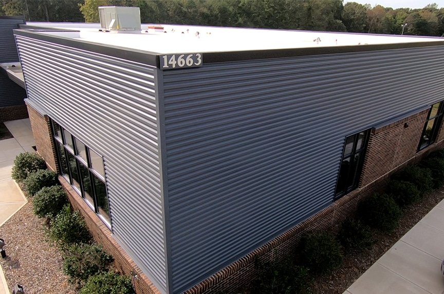 Steel Studs w/ Metal Siding and Brick Wainscot