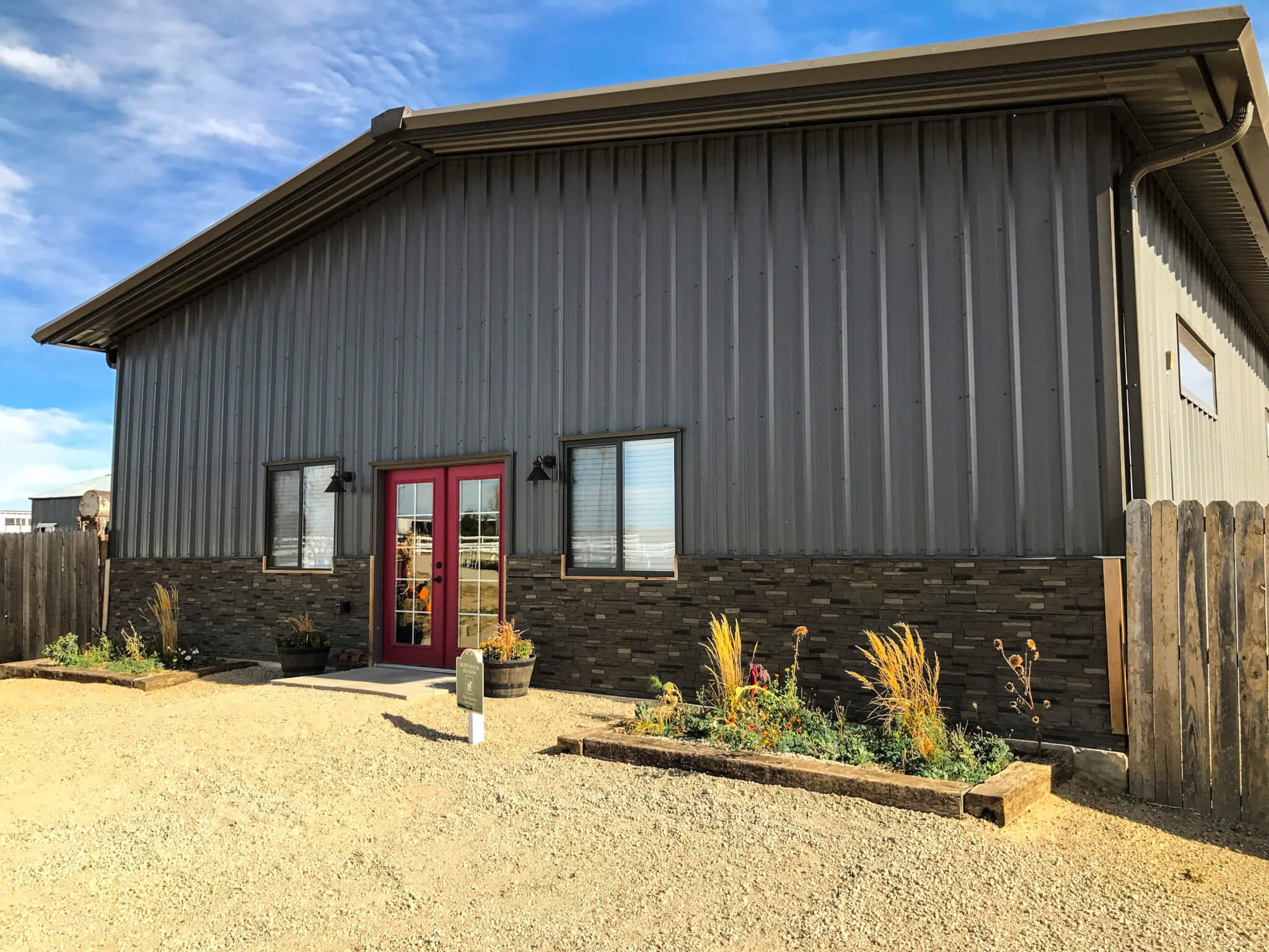 Steel Siding with Girts and Stone Wainscot