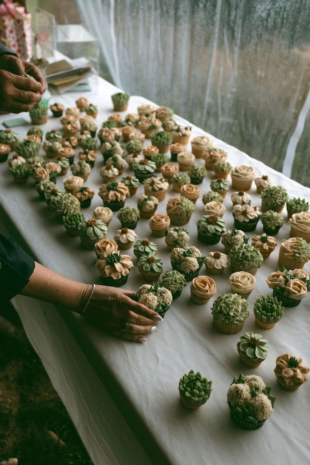Garden inspired bridal cupcakes for their tented wedding