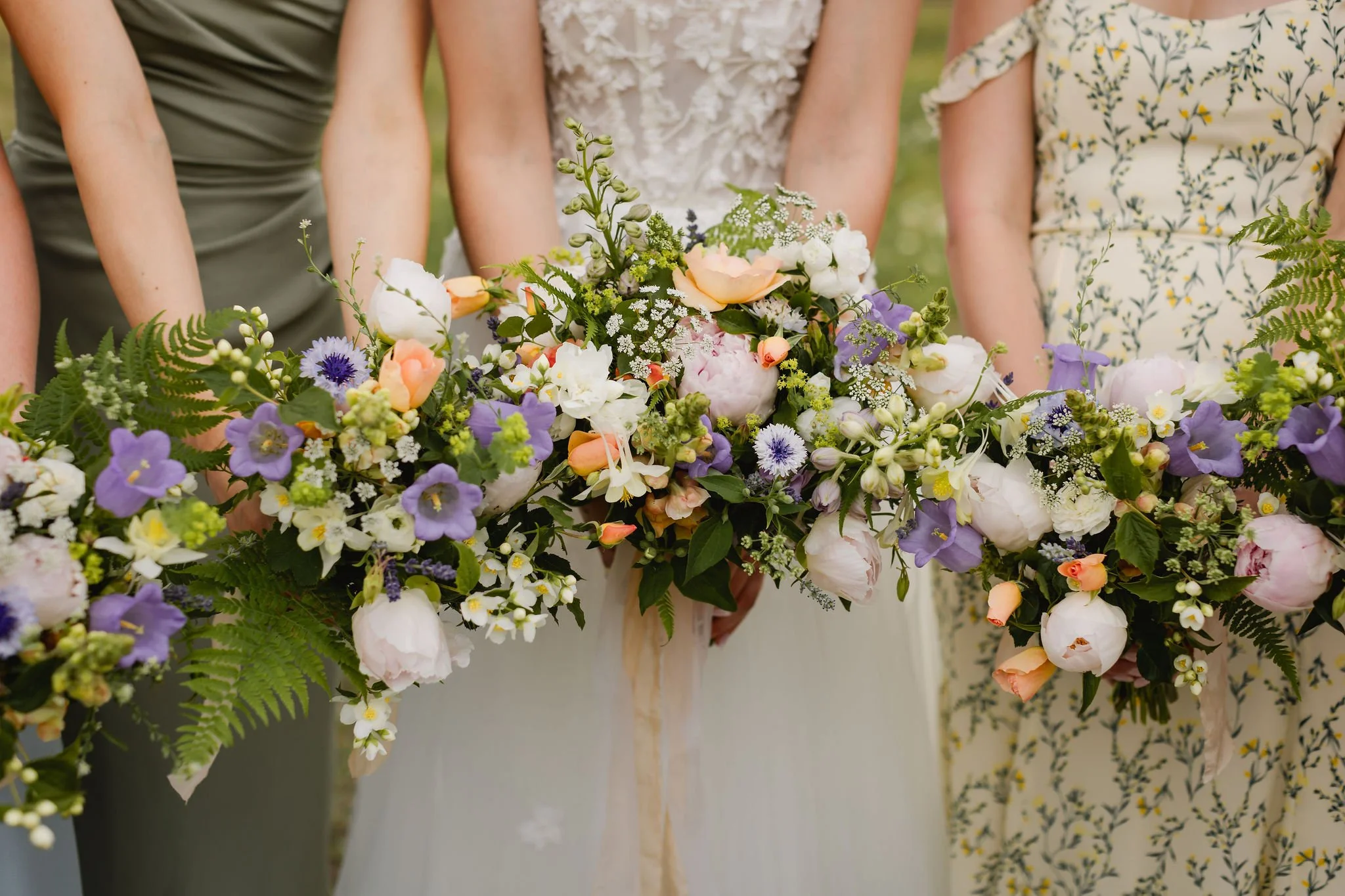 Pastel floral wedding bouquets with peonies, lisianthus, and wild greenery at Western chic BC wedding.