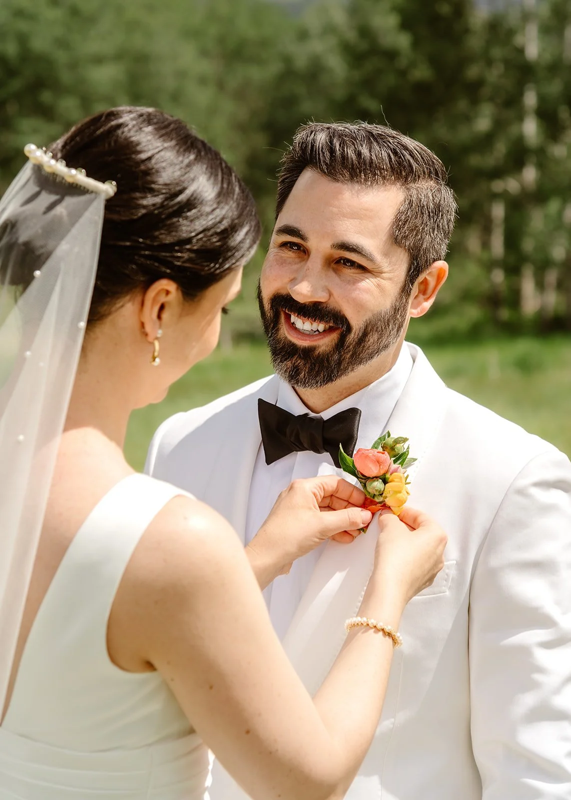 Romantic Mountain Wedding: Bride Adds Corsage to Groom 