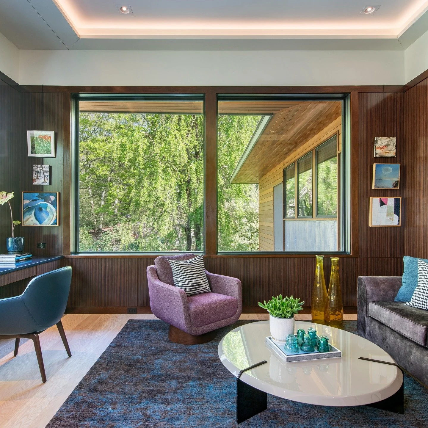 Working from home-chic edition. 
This jewel box room wrapped in rosewood paneling and with expansive windows that highlight the changing seasons redefines the home office. 

#moderndesign 
#luxurylifestyle 
#interiordesign
#architecture 
#natreaphoto