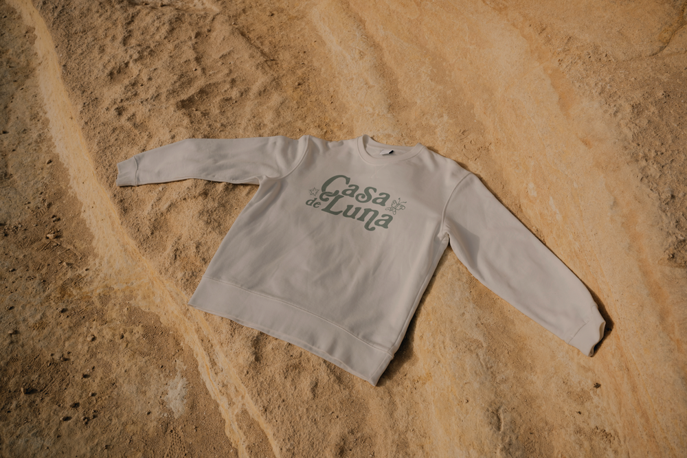 The Casa de Luna logo on a crewneck sweatshirt, mockup