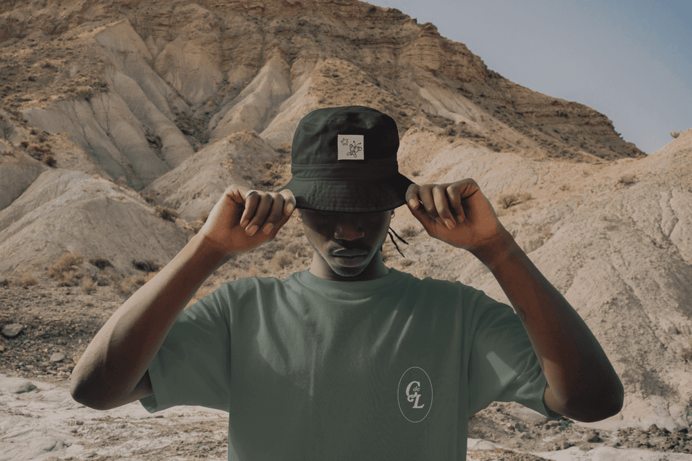 The submark on a green tee and black cap, mockup