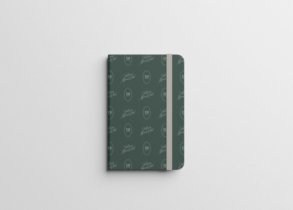 A notebook in the green monogram pattern