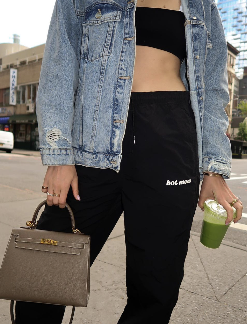 Black joggers with a small hot mom print