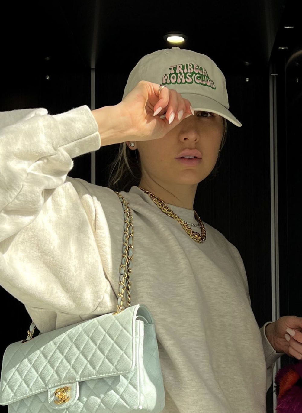 The bubbly logo on a cream dad hat