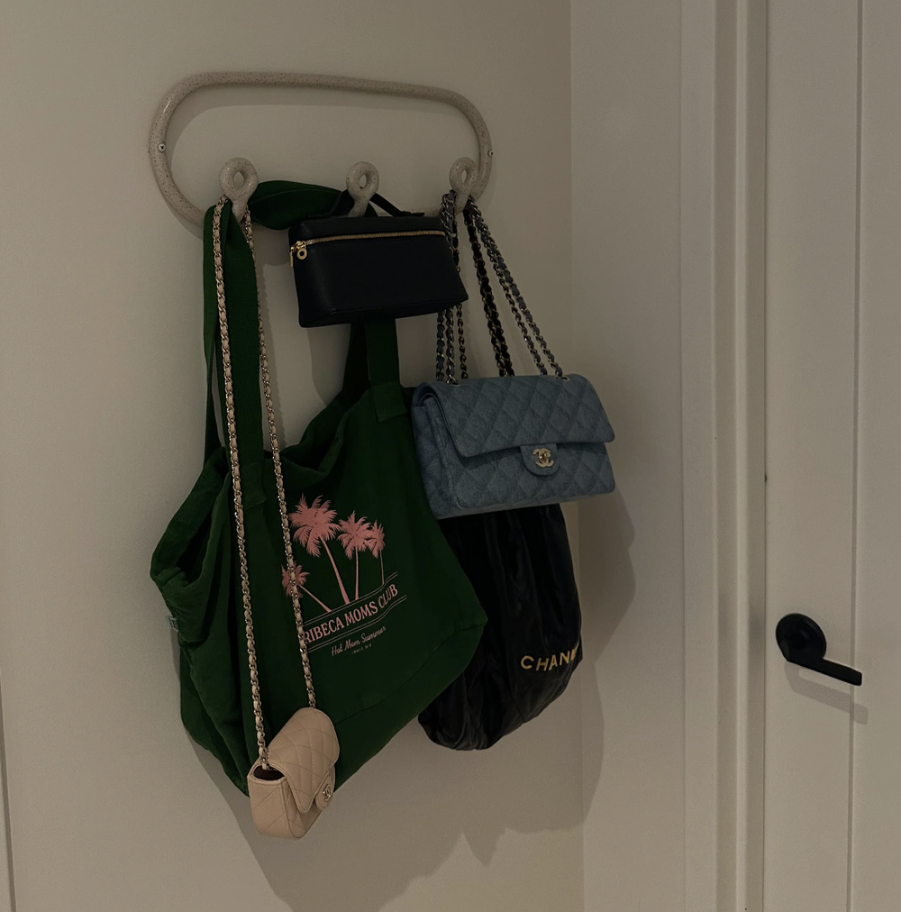The palm tree tote hanging by the door