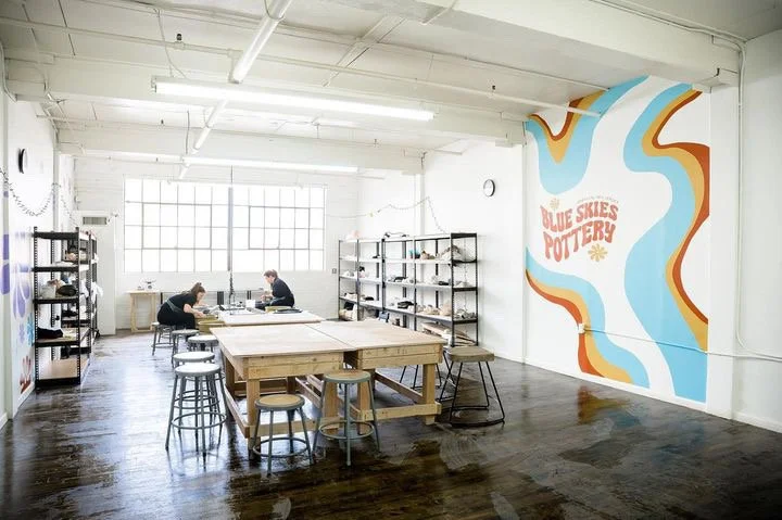 The Hoboken studio with the wavy logo mural