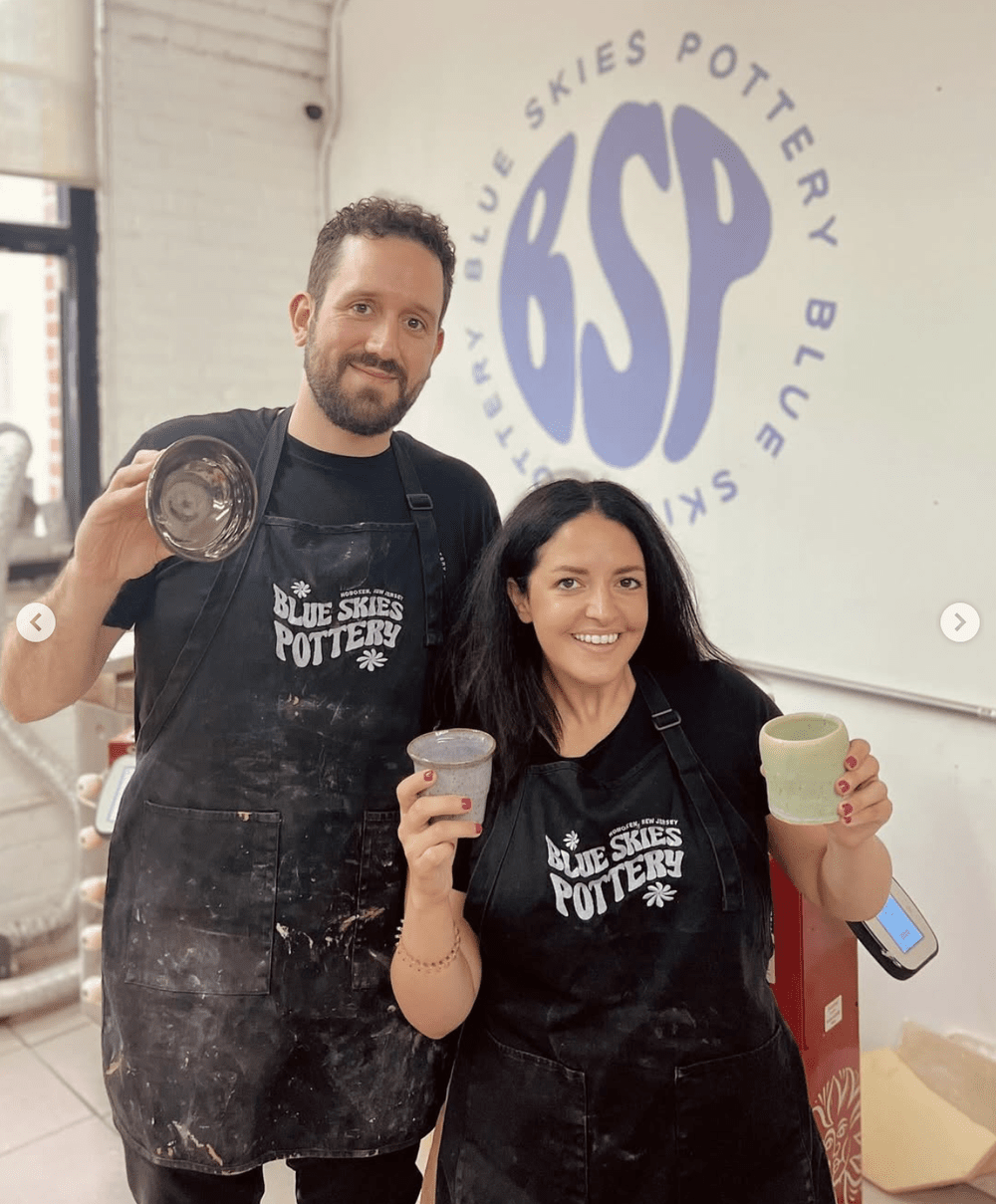 Valerie and Jordan in their aprons, in front of the BSP wall