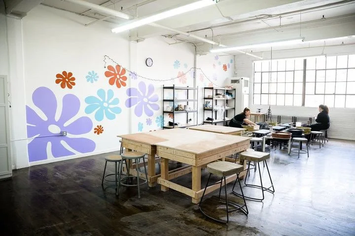 The flower painted big on the Hoboken studio wall