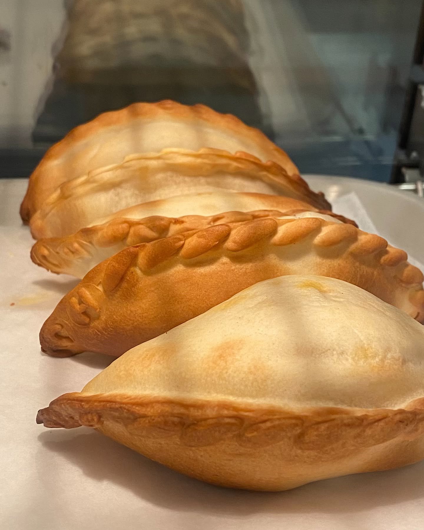 We are now serving delicious, baked empanadas in 4 yummy flavors- beef, chicken, spinach with cheese, and eggs with bacon. Only $3.50 each !!! Empanadas are the most portable, tasty, meal-in-one for those on the go !