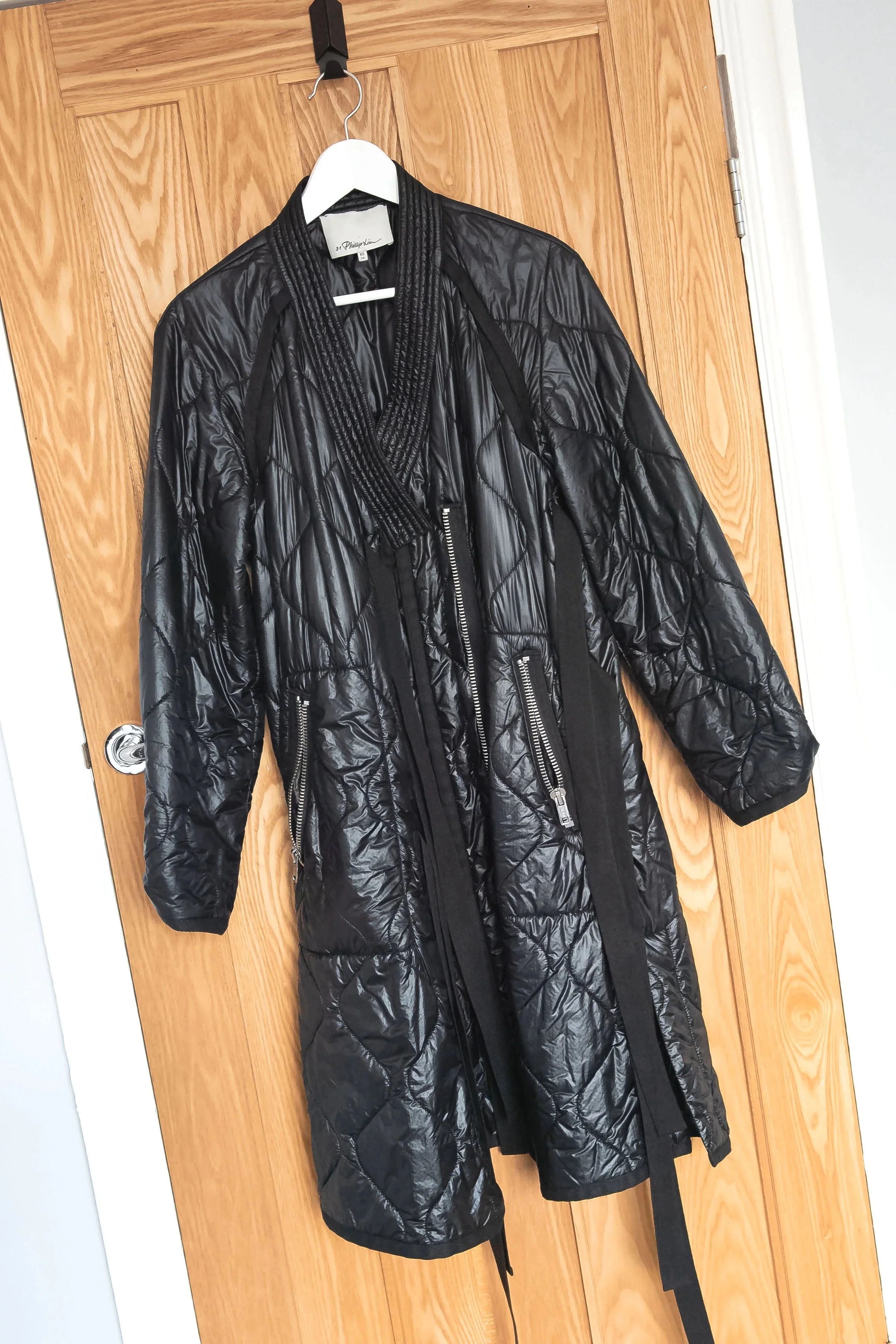 Quilted black designer rental coat.