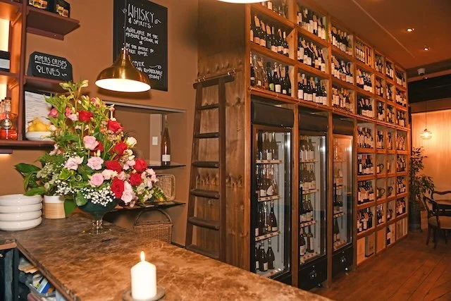 GSB_7119 Wine shelves with Shirley's flower arrangement_1.jpg