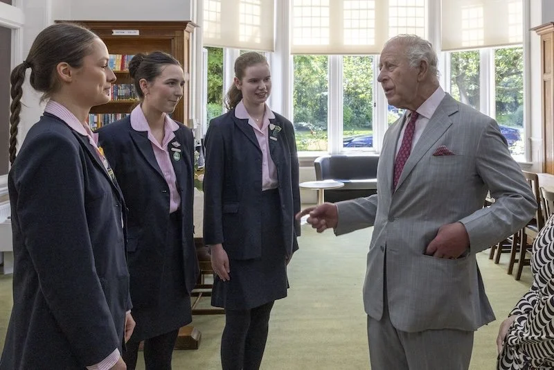 College prefects Tilly, Tabby and Jemima, meeting King Charles.jpg