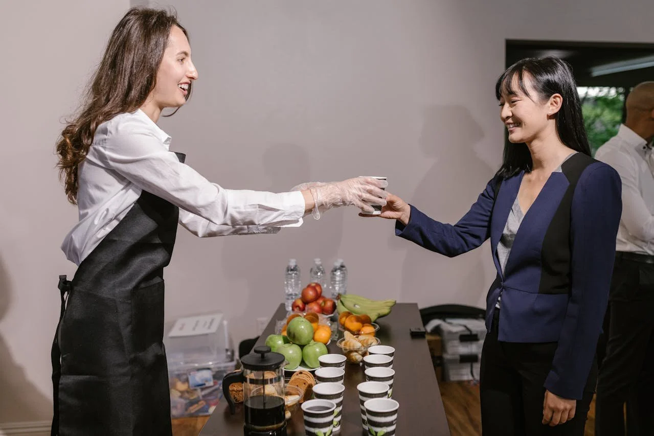Woman taking coffee at event