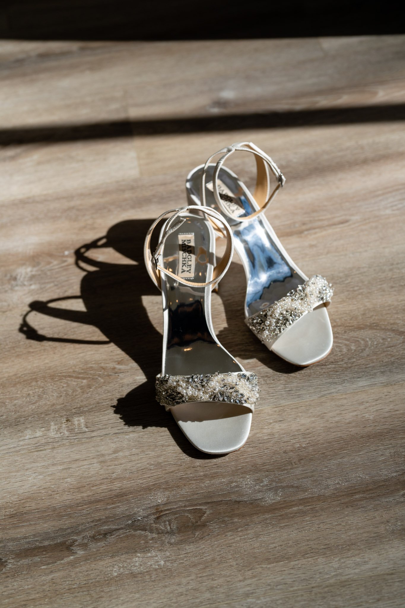 Silver healed bridal shoes with bejeweled straps in the sun at the Arlo Austin TX The Amber Studio