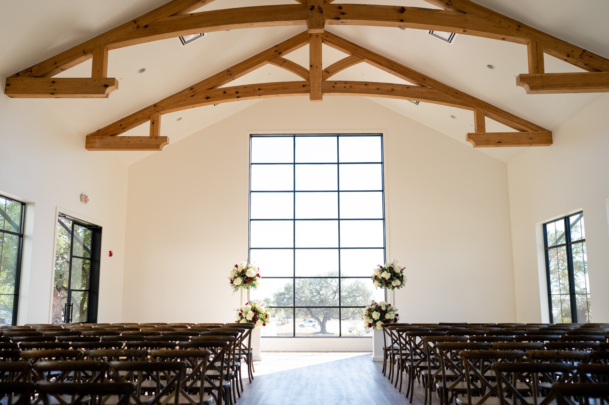 A large sunny room with massive windows set for a wedding at The Arlo in Texas The Amber Studio