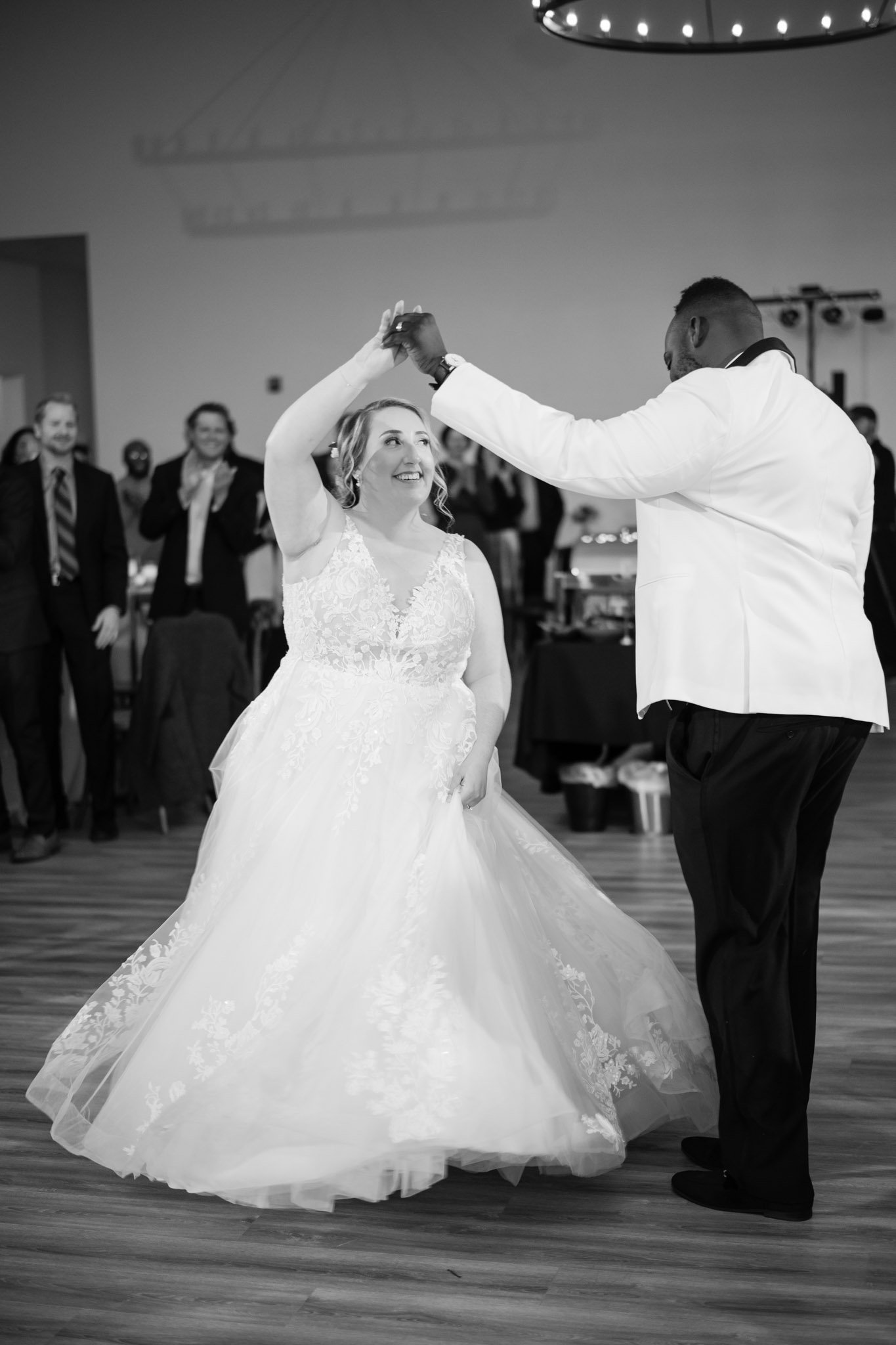 Multiracial newlyweds have their first dance together inside the Arlo in Austin TX The Amber Studio