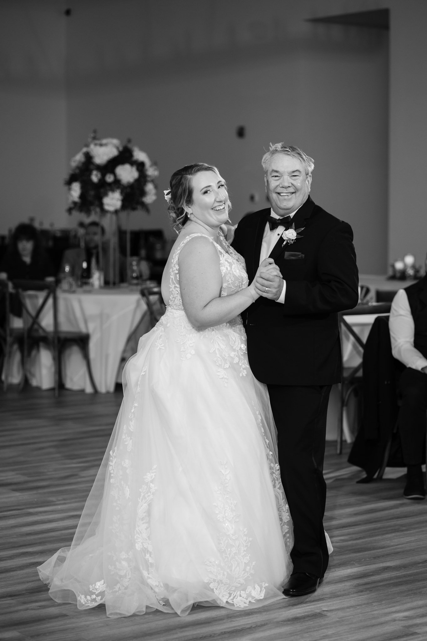 Smiling bride dances with their father on the dance floor at The Arlo in Austin TX The Amber Studio