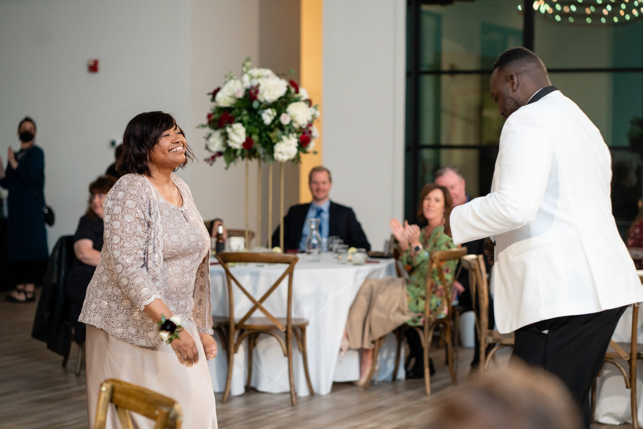 Groom dances with his mother on the dance floor at the Arlo in Texas the Amber Studio