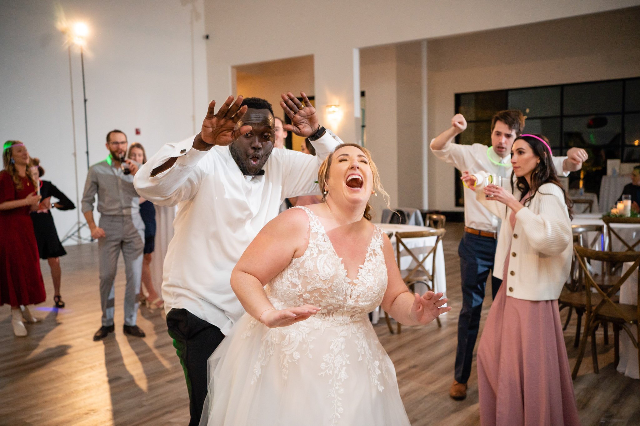 Newlyweds dance surrounded by their guests dancing at the Arlo in Austin The Amber Studio