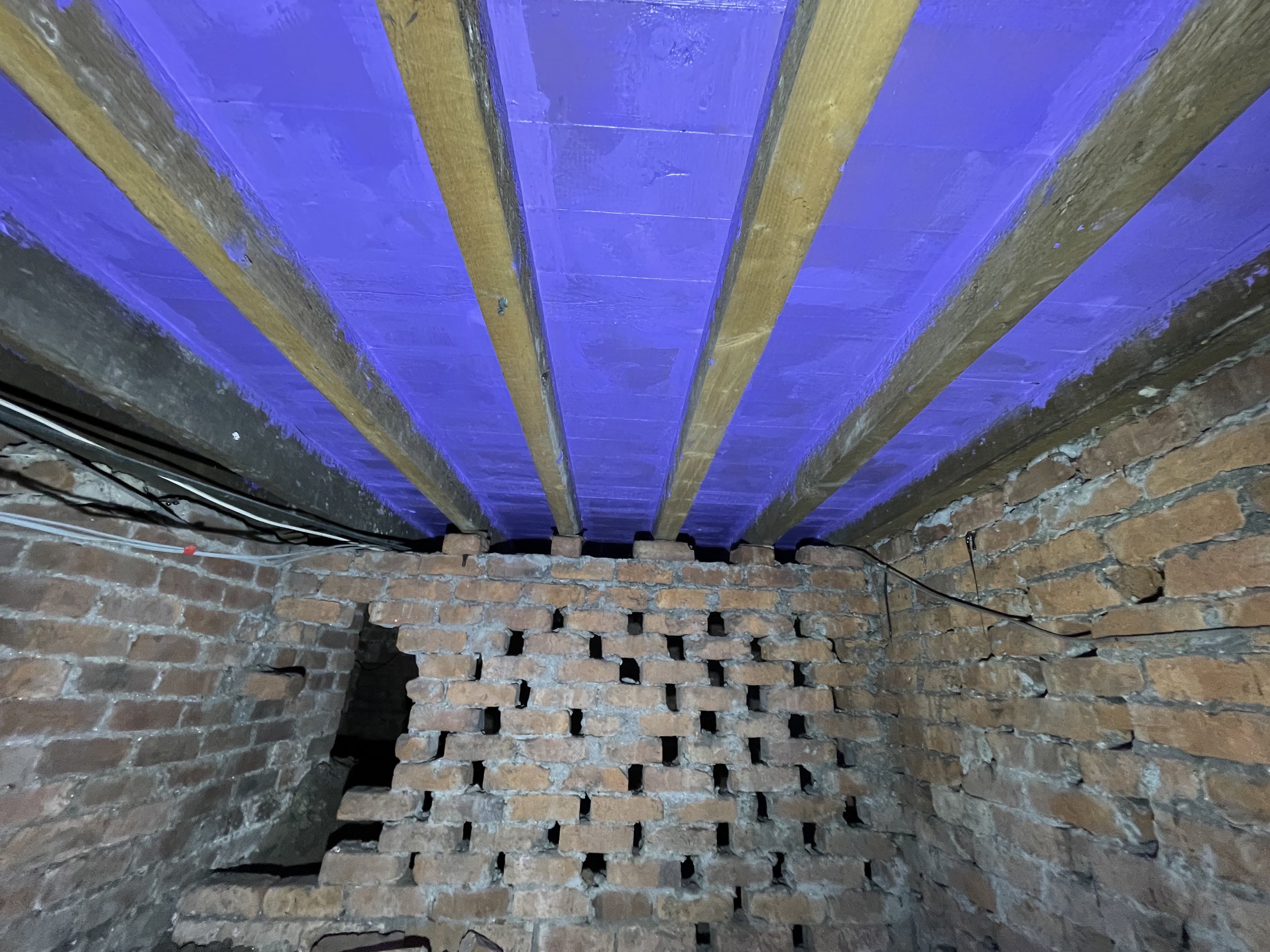 Underfloor insulation - liquid airtightness layer applied to under side of floor