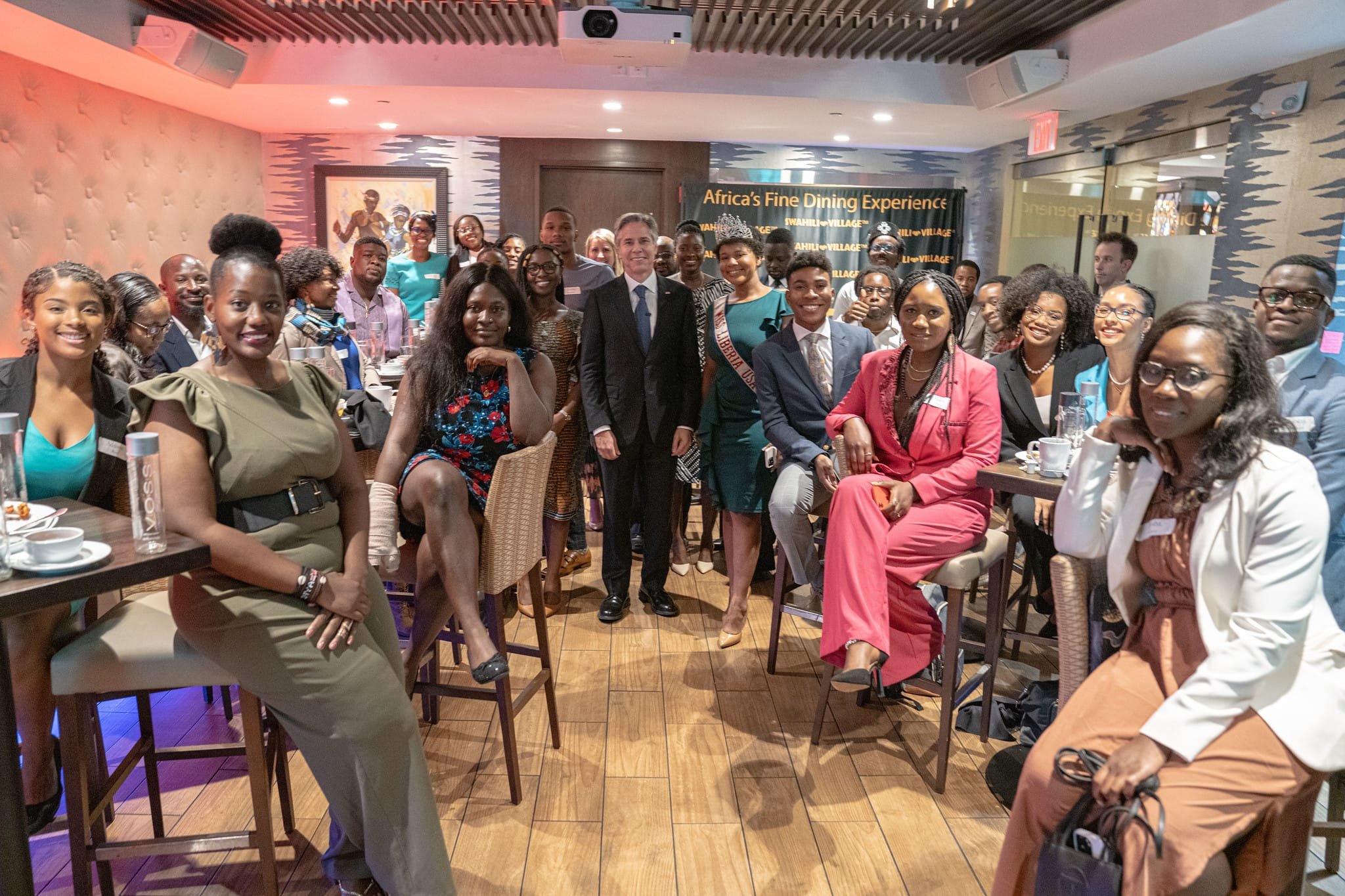 Anya Dillard, Kahlil Greene, Channing Hill, Nupol Kiazolu, Tylik McMillan, and Jerome Treadwell-Richardson (of The Youth Never Let Up Coalition), US Secretary of State Anthony Blinken, and leaders from across the African Disora at Swahili Village The