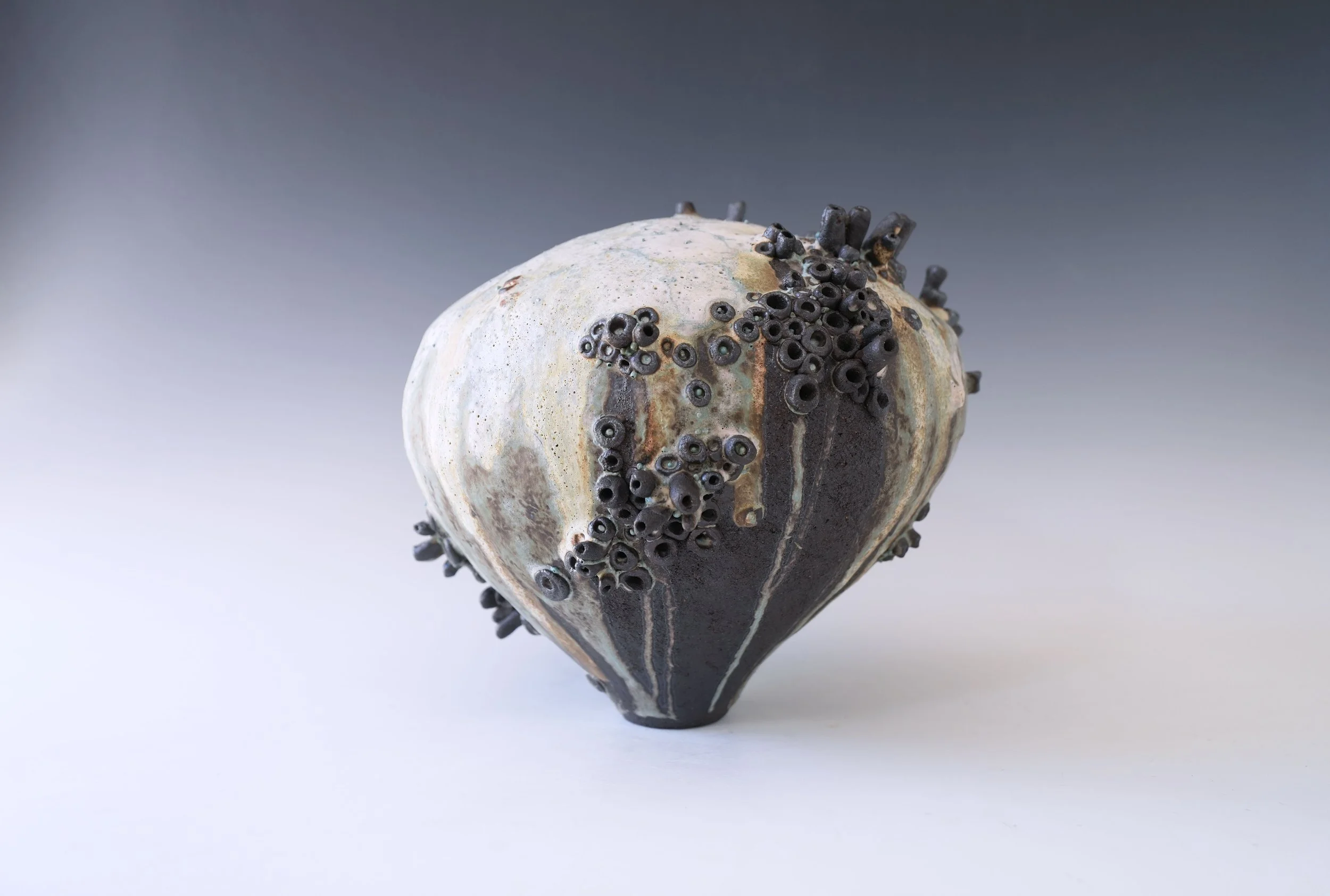 textured porcelain vase inspired by natural stone surfaces