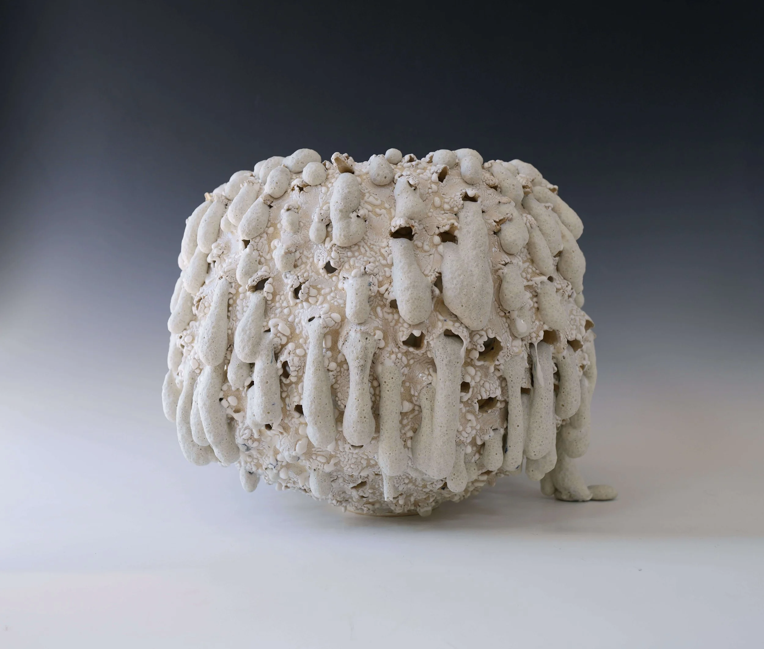 sculptural ceramic moon jar with crater texture, handmade porcelain vase