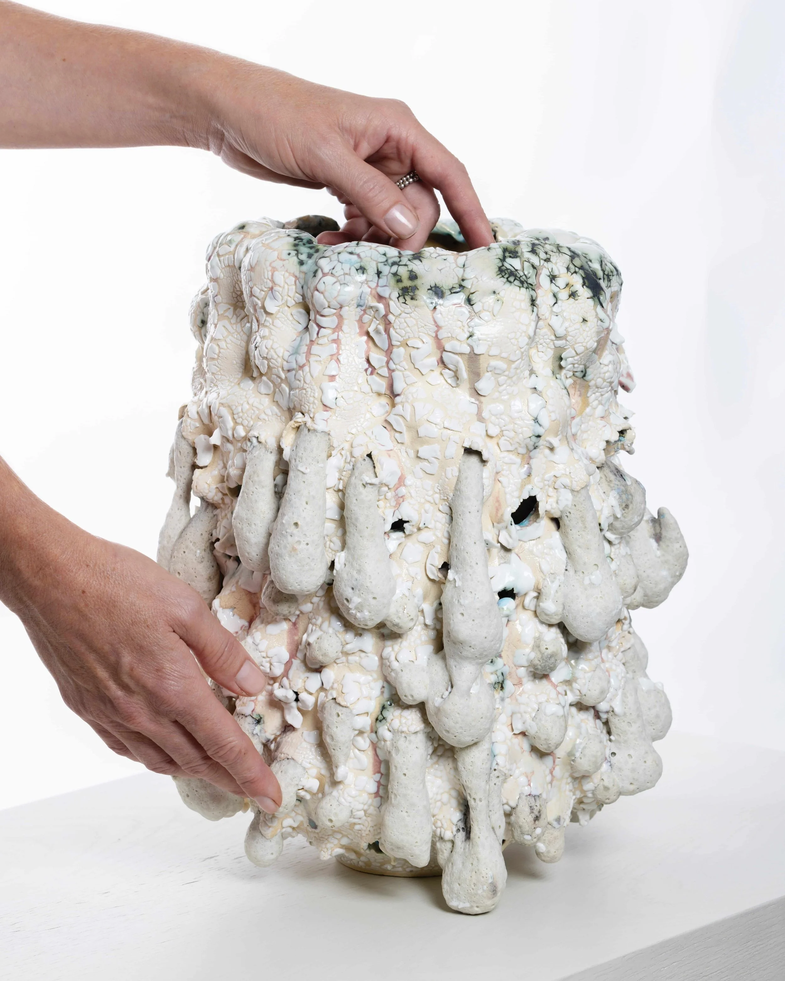 ceramic vase with hands
