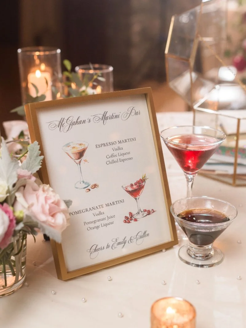 Elegant wedding table with framed sign and candle, capturing a warm and intimate celebration setup