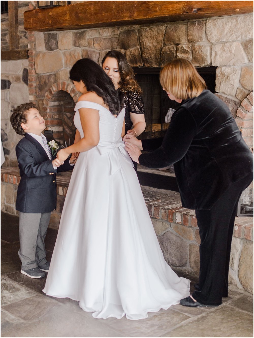 bride getting ready and having her Mom zip up the back of her dress at an intimate wedding ceremony at the mohawk house, NJ elopement