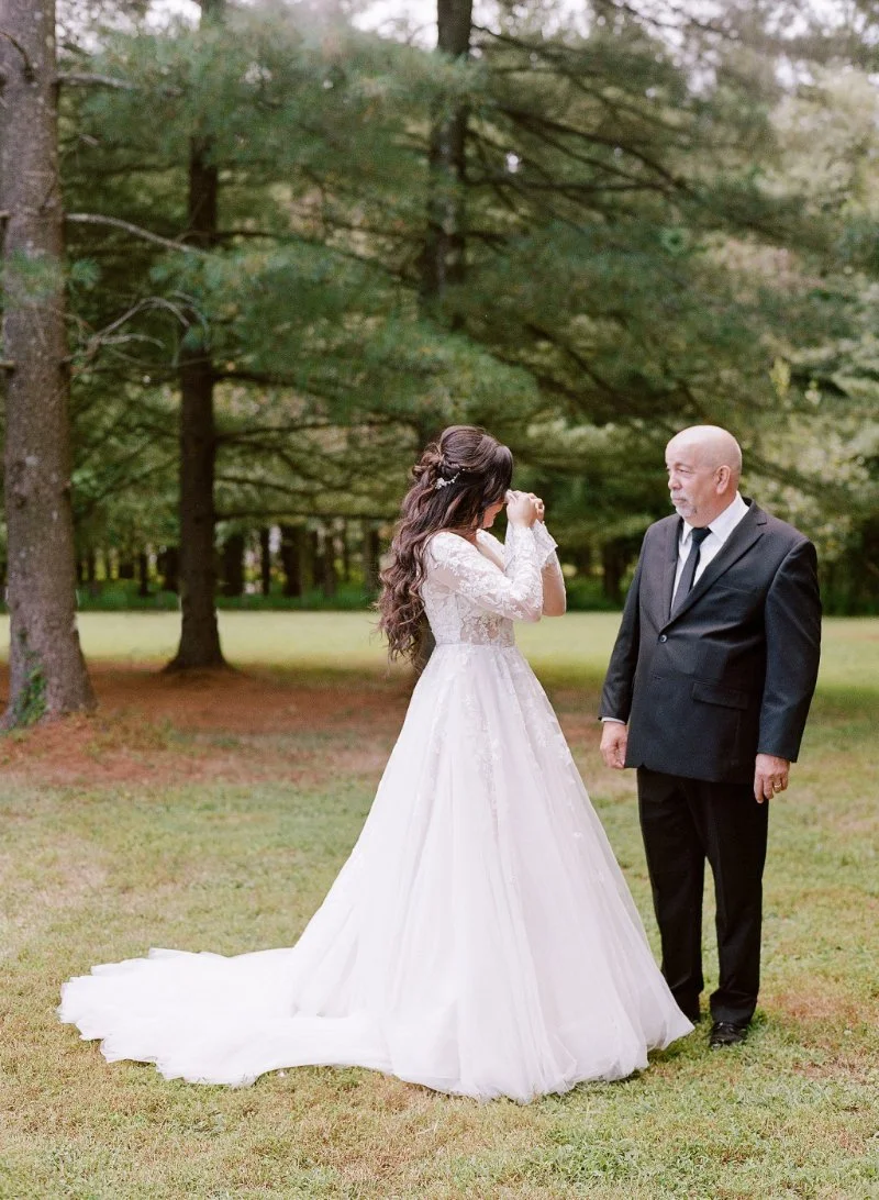  getting ready wedding photography of an emotional first look between the bride and her father 