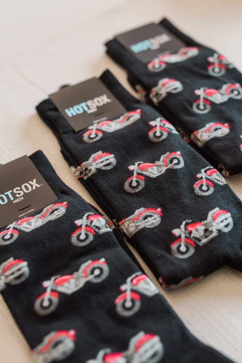  motorcycle themed dress socks flat lay during getting ready wedding photography 